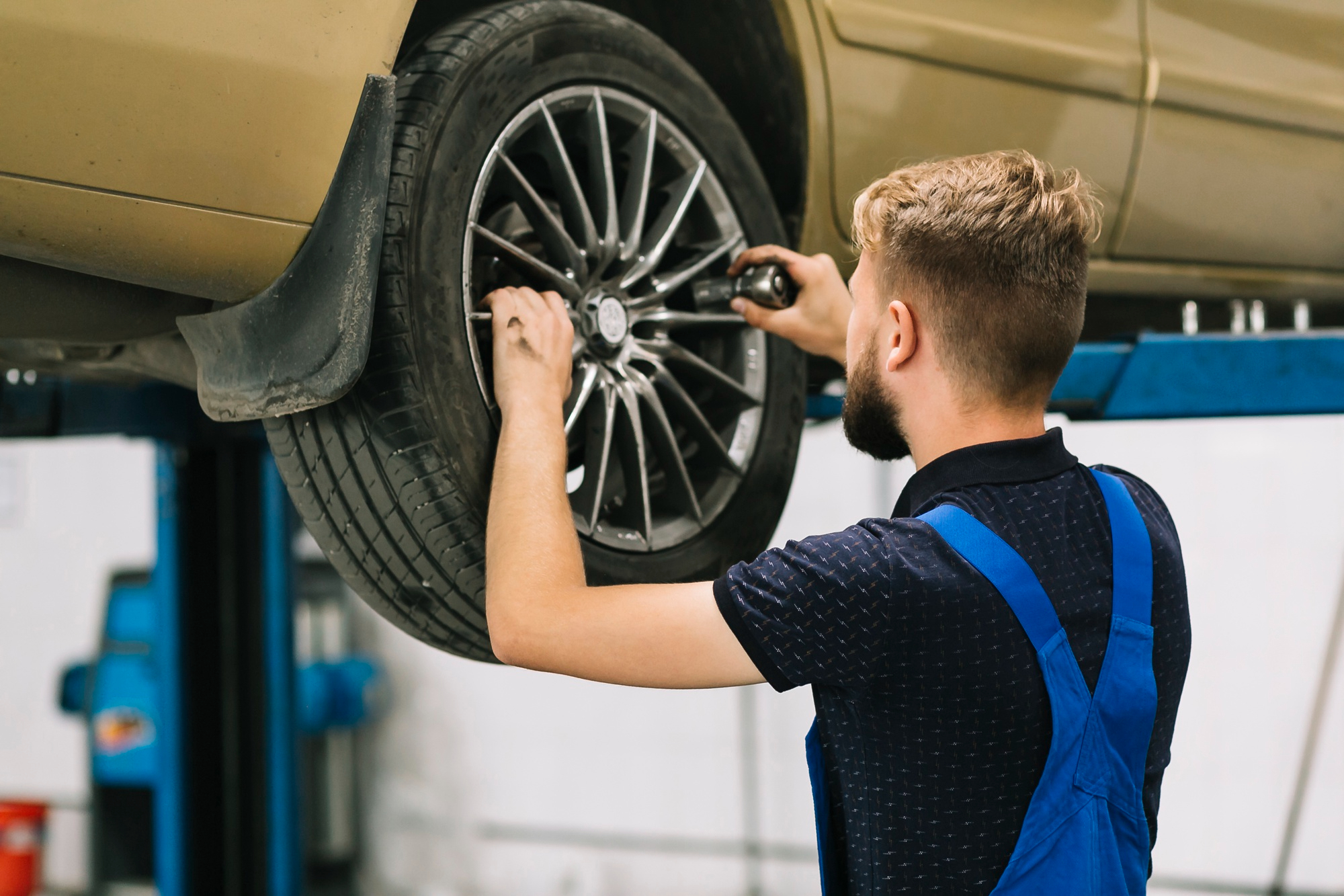Expert mechanic conducting tire repairs