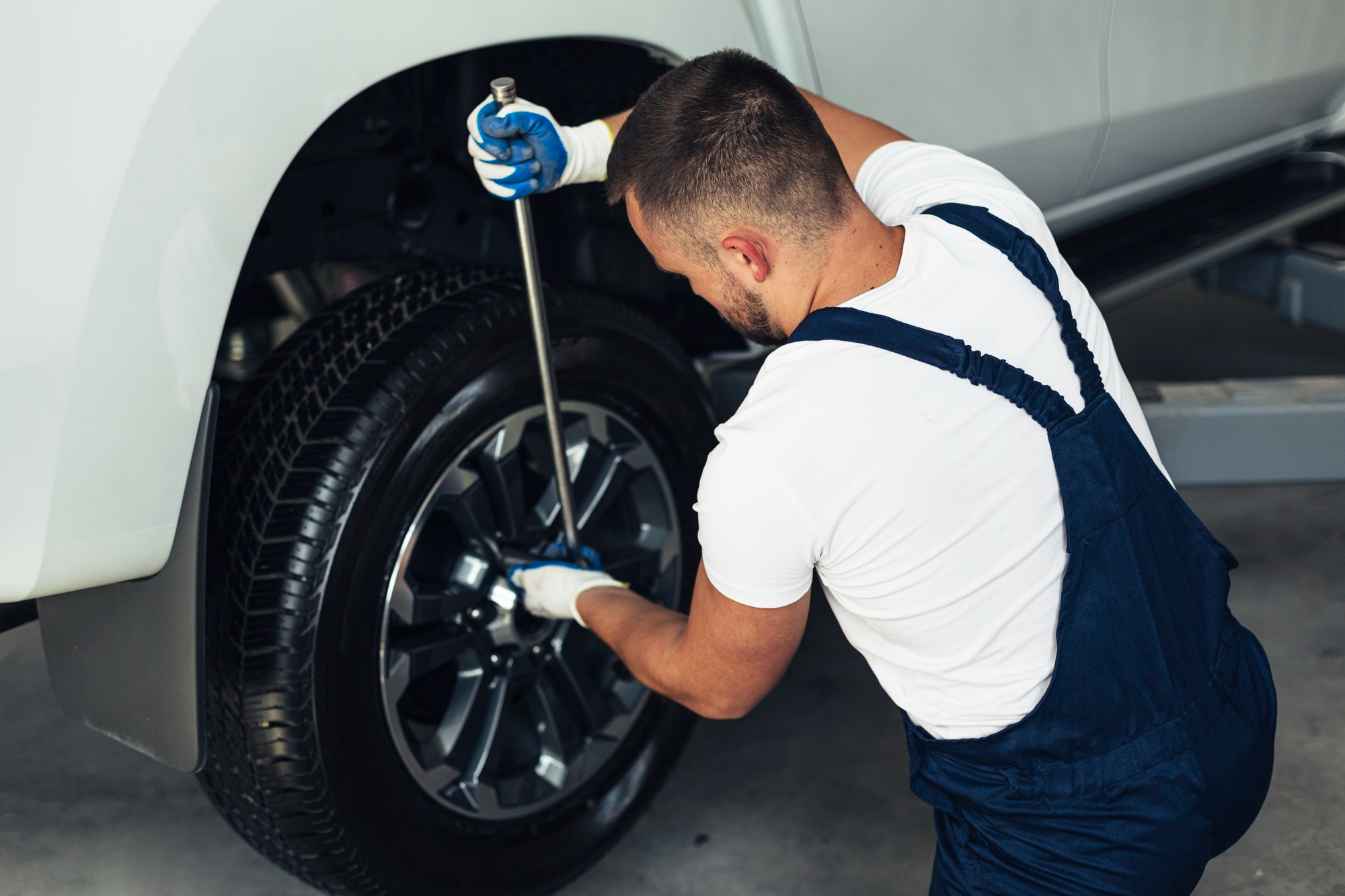 Expert mechanic conducting tire repairs
